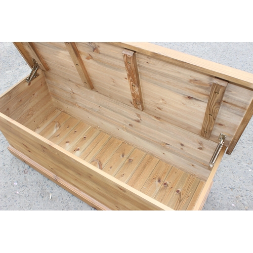 53 - A large vintage pine ottoman or blanket box, approx 123cm wide x 46cm deep x 48cm tall