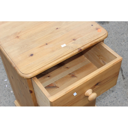 57 - A pine 3 drawer bedside table, approx 46cm wide x 40cm deep x 77cm tall