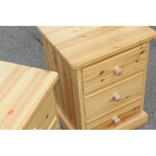 56 - A pair of pine bedside tables with 3 drawers, approx 43cm wide x 40cm deep x 61cm tall