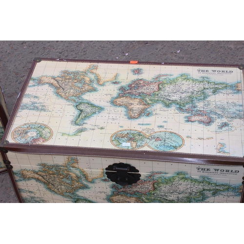 60 - 2 trunks with map design, each approx 68cm wide x 40cm deep x 45cm tall