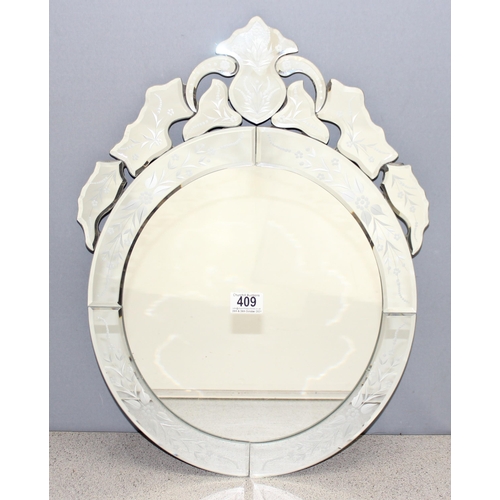 409 - Venetian style wall mirror with floral decoration, approx 56cm x 38cm