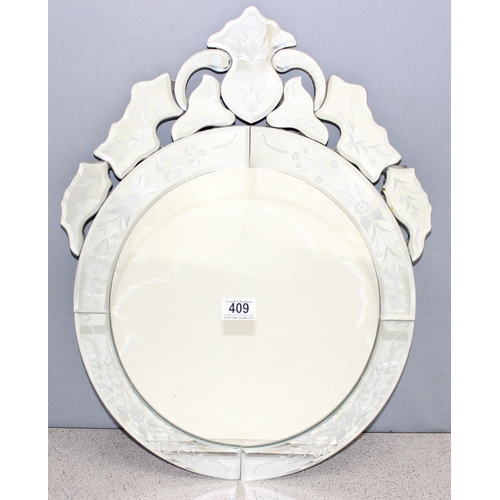 409 - Venetian style wall mirror with floral decoration, approx 56cm x 38cm