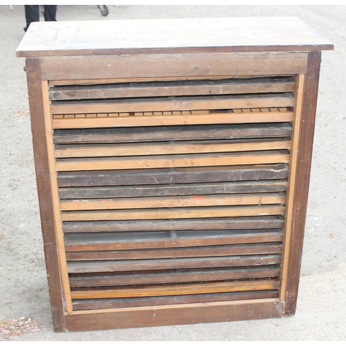 43 - A vintage Caslon Machinery printer's chest of drawers with a harlequin mix of drawers and handles, a... 