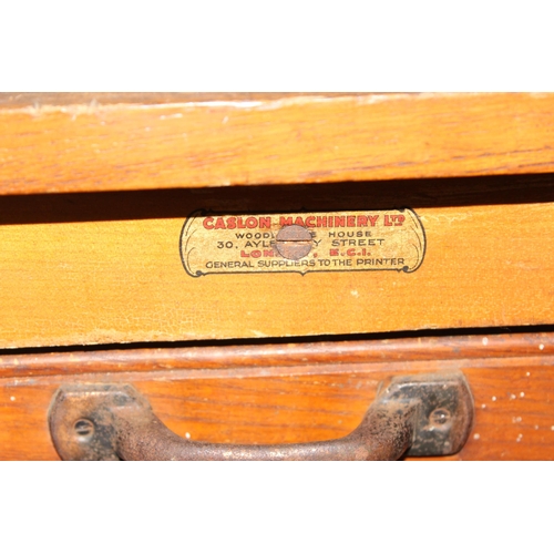 43 - A vintage Caslon Machinery printer's chest of drawers with a harlequin mix of drawers and handles, a... 