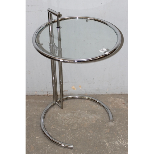 66 - In the manner of Eileen Grey, a modern glass and chrome circular occasional table after a design by ... 