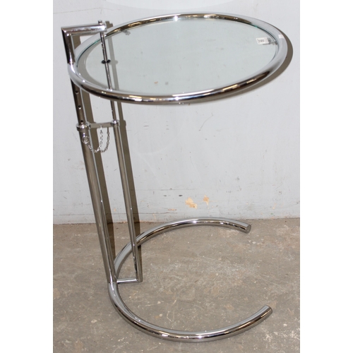 66 - In the manner of Eileen Grey, a modern glass and chrome circular occasional table after a design by ... 