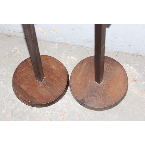 76 - An unusual pair of adjustable wooden floor standing candlesticks, approx 125cm tall (170cm fully ext... 