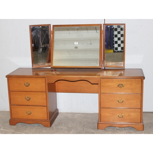 80 - A retro Stag dressing table with 6 drawers and 3 mirrors, approx 160cm wide x 44cm deep x 120cm tall