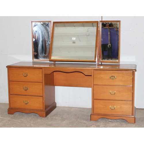 80 - A retro Stag dressing table with 6 drawers and 3 mirrors, approx 160cm wide x 44cm deep x 120cm tall