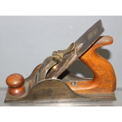 805 - An antique brass and steel woodworking plane with wooden handle, seemingly unmarked but of excellent... 