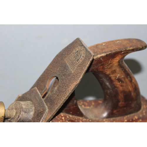 806 - An antique brass and steel woodworking plane with wooden handle, seemingly unmarked but of excellent... 