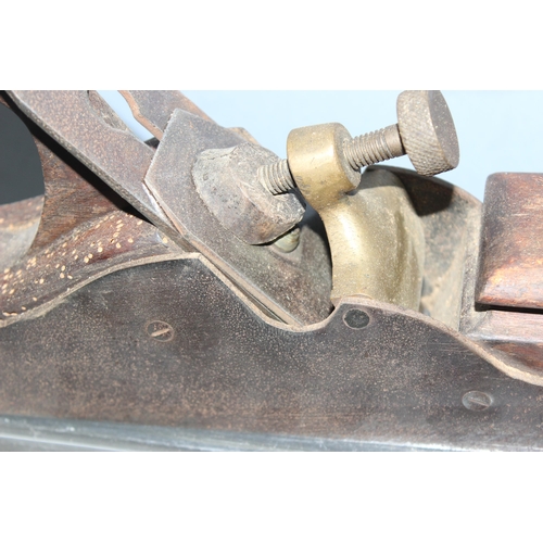 806 - An antique brass and steel woodworking plane with wooden handle, seemingly unmarked but of excellent... 