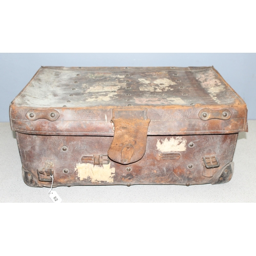 82 - A vintage leather travel trunk with a large number of period labels, by A. Boswell of Edinburgh, app... 