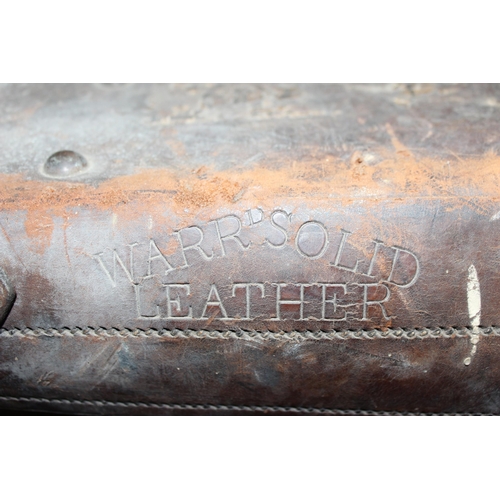 82 - A vintage leather travel trunk with a large number of period labels, by A. Boswell of Edinburgh, app... 