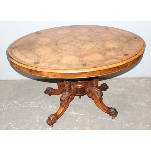 9 - A 19th century tilt-topped walnut oval table with Tunbridgeware inlay and carved pedestal base, appr... 