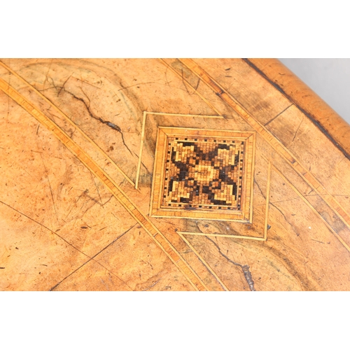 9 - A 19th century tilt-topped walnut oval table with Tunbridgeware inlay and carved pedestal base, appr... 