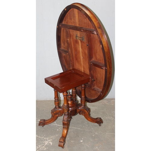 9 - A 19th century tilt-topped walnut oval table with Tunbridgeware inlay and carved pedestal base, appr... 