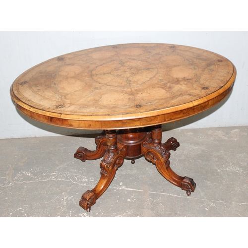 9 - A 19th century tilt-topped walnut oval table with Tunbridgeware inlay and carved pedestal base, appr... 