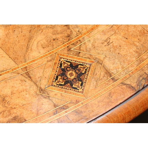 9 - A 19th century tilt-topped walnut oval table with Tunbridgeware inlay and carved pedestal base, appr... 