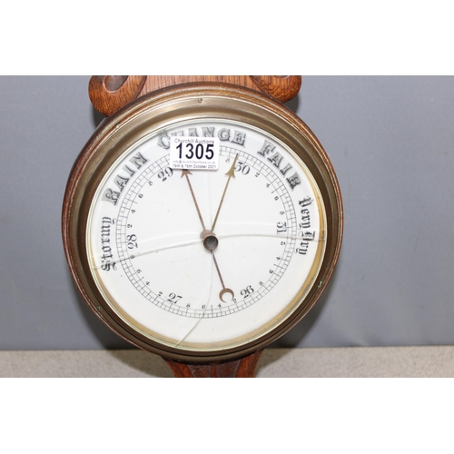 1305 - An antique oak cased aneroid wall barometer, approx 85cm tall