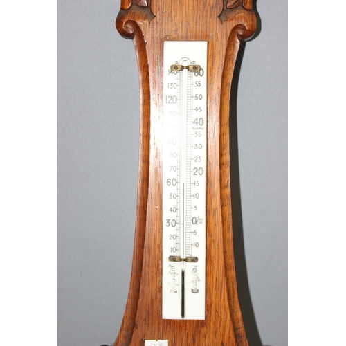 1305 - An antique oak cased aneroid wall barometer, approx 85cm tall