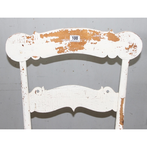 100 - A vintage Scandinavian rocking chair with distressed white painted finish, carved with E Nyblom 1928... 