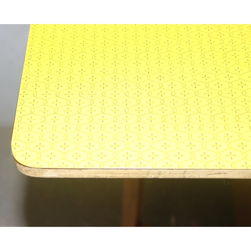 109 - A vintage yellow Formica topped drop leaf dining table, approx 91cm wide x 61cm deep x 76m tall