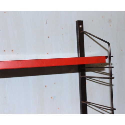 113 - Retro red wall shelf with black supports, Tomado style, approx 41cm wide