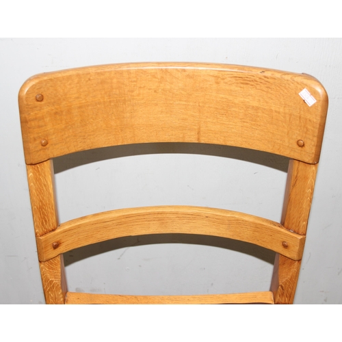 115 - Pair of mid 20th century Gordon Russell design light oak chairs with peg detail, likely retailed by ... 