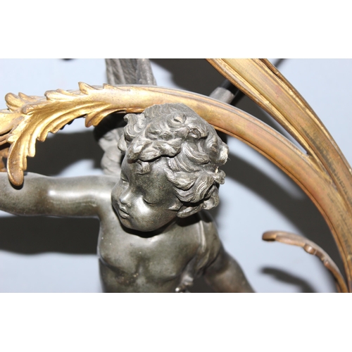 243 - Antique French 3-branch Belle Epoque patinated table lamp with cast bronzed metal cherub and gilt de... 