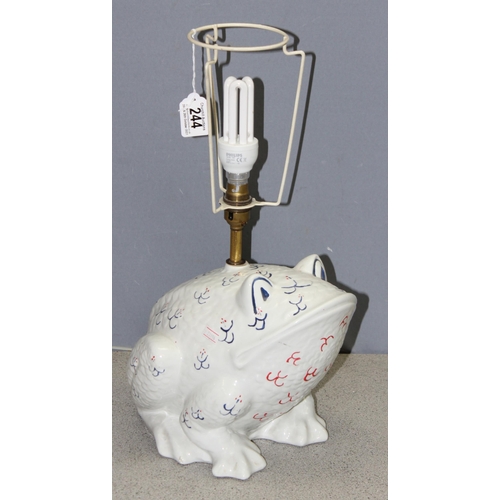 244 - An interesting Italian made white glazed ceramic lamp base in the form of a frog with blue and red d... 