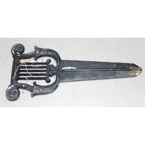 303 - Georgian style cast iron boot scraper of neo-classical lyre design, approx 33cm x 45cm