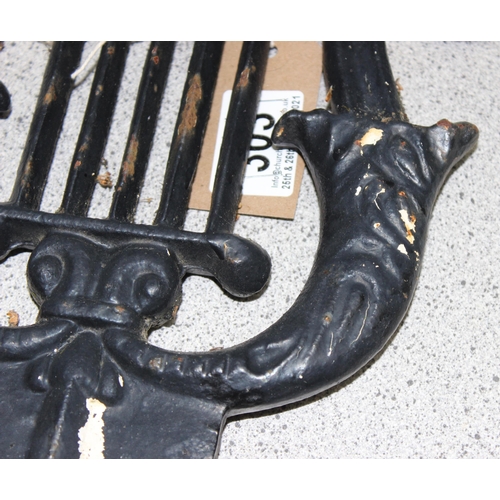 303 - Georgian style cast iron boot scraper of neo-classical lyre design, approx 33cm x 45cm