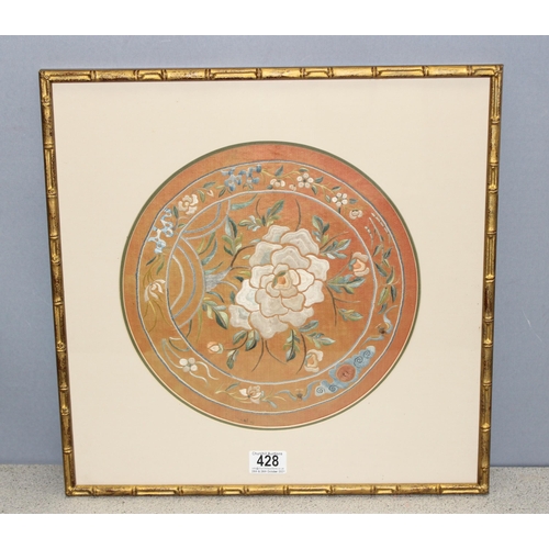 428 - Chinese embroidered silk panel in glazed gilt bamboo effect frame of floral design on peach coloured... 