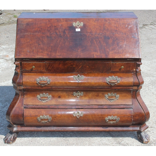 87 - Early 20th century Dutch figured walnut bombe bureau, fall-front enclosing fitted interior with cent... 