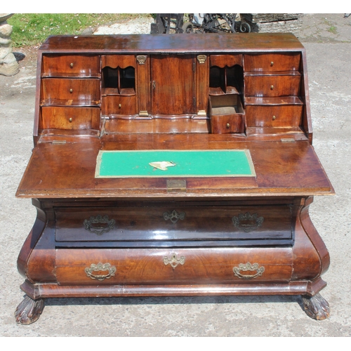 87 - Early 20th century Dutch figured walnut bombe bureau, fall-front enclosing fitted interior with cent... 