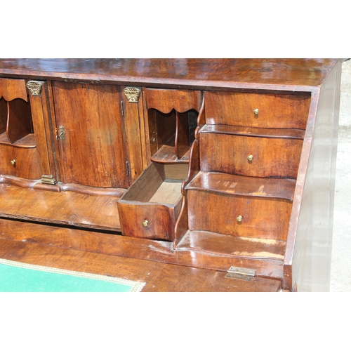 87 - Early 20th century Dutch figured walnut bombe bureau, fall-front enclosing fitted interior with cent... 