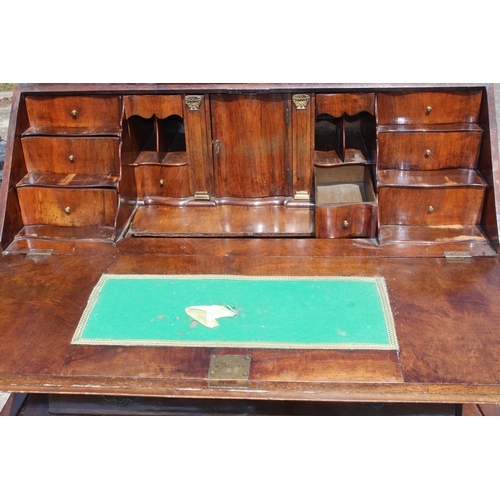 87 - Early 20th century Dutch figured walnut bombe bureau, fall-front enclosing fitted interior with cent... 