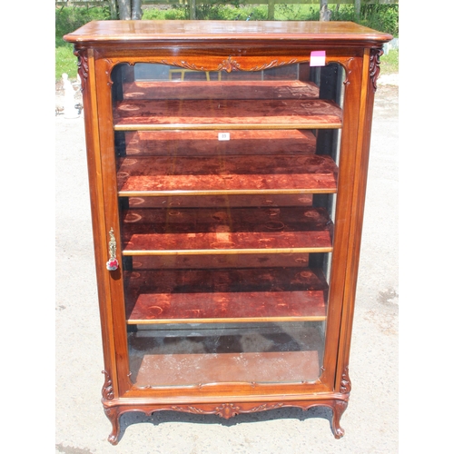 89 - A Continental carved mahogany display cabinet with velvet lines shelves and mirrored back, likely 19... 