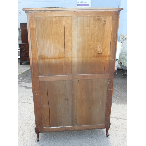 89 - A Continental carved mahogany display cabinet with velvet lines shelves and mirrored back, likely 19... 