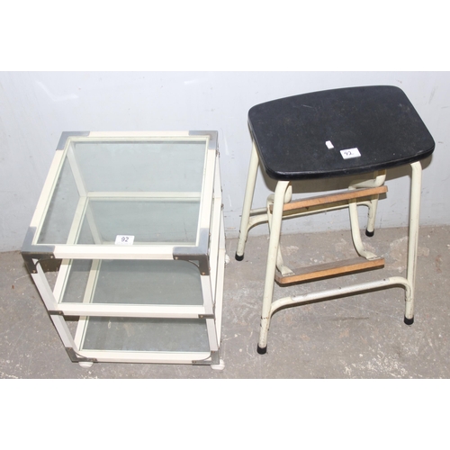 92 - A retro glass table on wheels and a vintage scullery step stool, table approx 40cm wide x 40cm deep ... 