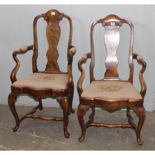 95 - A near pair of Queen Anne style walnut open armchairs with tapestry seats, likely early 20th century