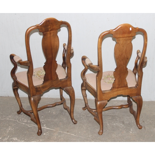 95 - A near pair of Queen Anne style walnut open armchairs with tapestry seats, likely early 20th century