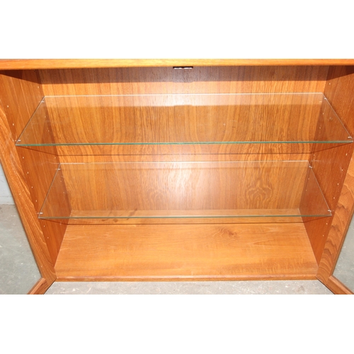 117 - 1960’s Danish style solid teak 2-door wall mounted /table top display cabinet with 2 adjustable and ... 