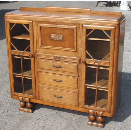 120 - A decorative Art Deco period light oak bureau with glazed bookcase sides, approx 120cm wide x 34cm d... 