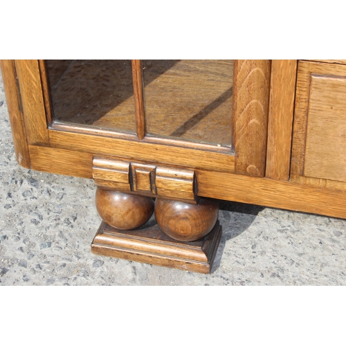 120 - A decorative Art Deco period light oak bureau with glazed bookcase sides, approx 120cm wide x 34cm d... 