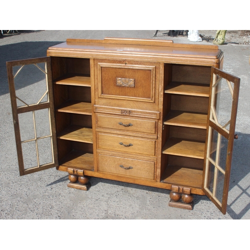 120 - A decorative Art Deco period light oak bureau with glazed bookcase sides, approx 120cm wide x 34cm d... 