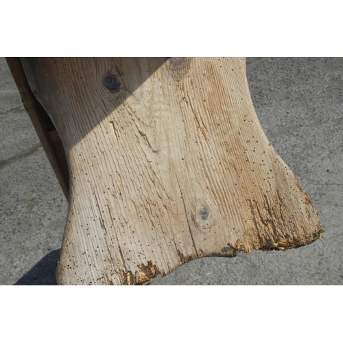 121 - A long rustic pine low bench, approx 255cm wide x 28cm deep x 39cm tall