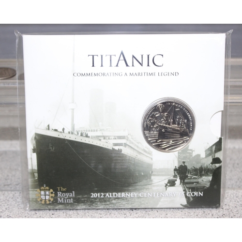 1215 - 4 vintage silver coins to inc a 1960 Swiss 2 Franc, 2 sealed £5 coins to inc the Titanic and a Londo... 