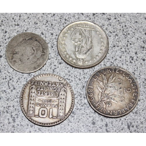 1215 - 4 vintage silver coins to inc a 1960 Swiss 2 Franc, 2 sealed £5 coins to inc the Titanic and a Londo... 